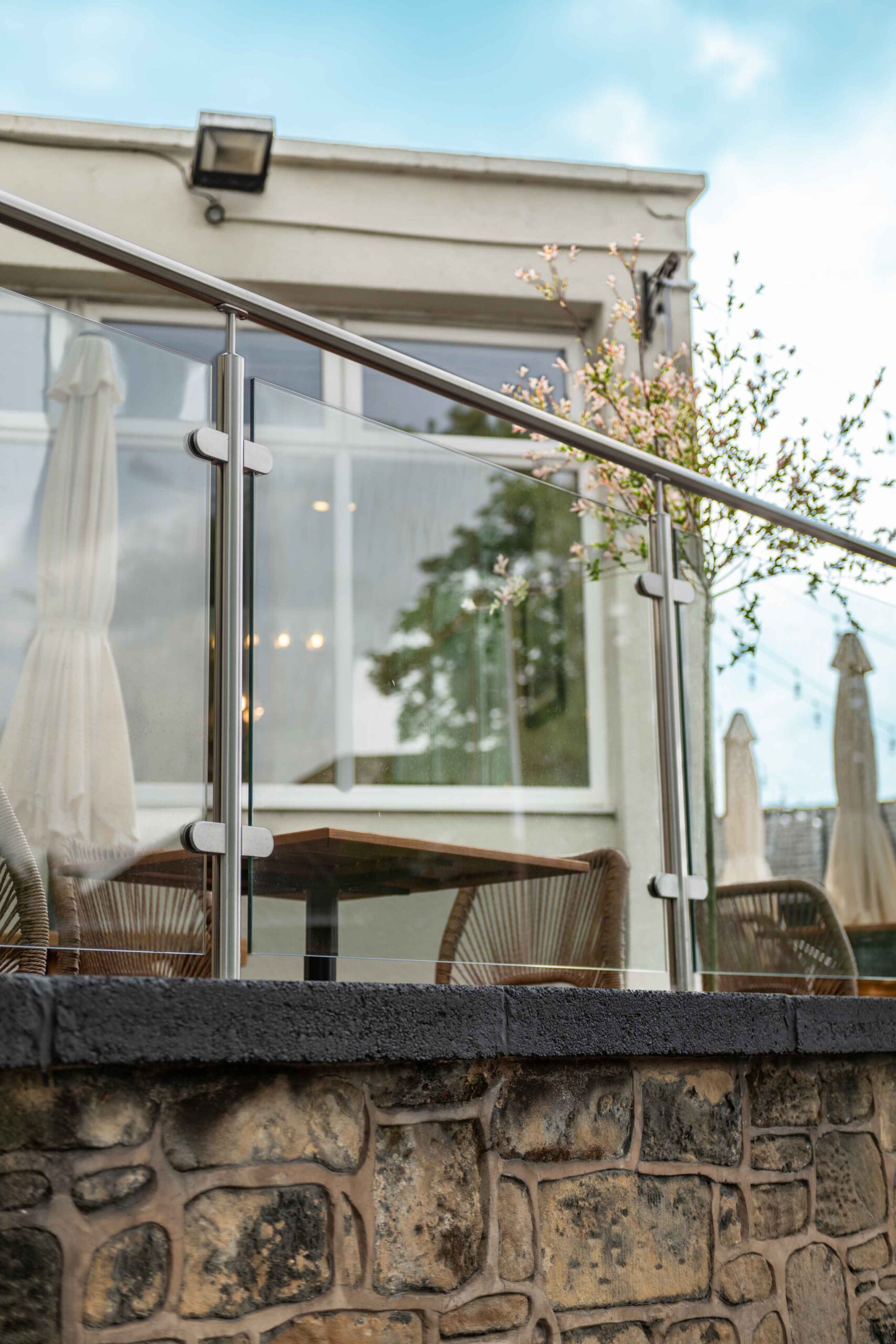 Glass railings at The Queens Arms Garden
